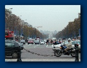 Paris streets seen from the base of the Arc de Triomphe.